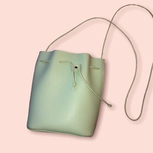 Teal mini bag with rope shoulder strap
